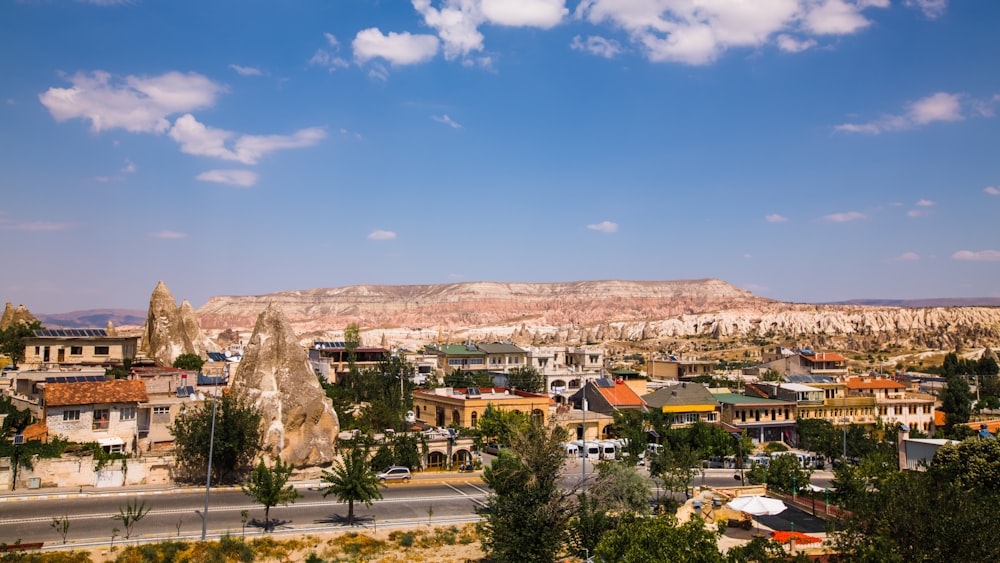 a view of a city with mountains in the background