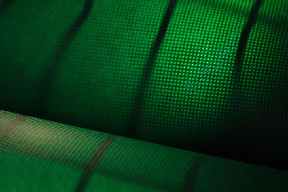 a close up view of a green fabric