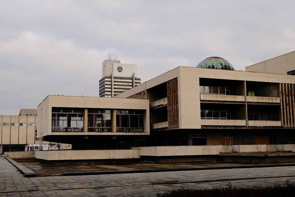 a large building with a clock tower in the background