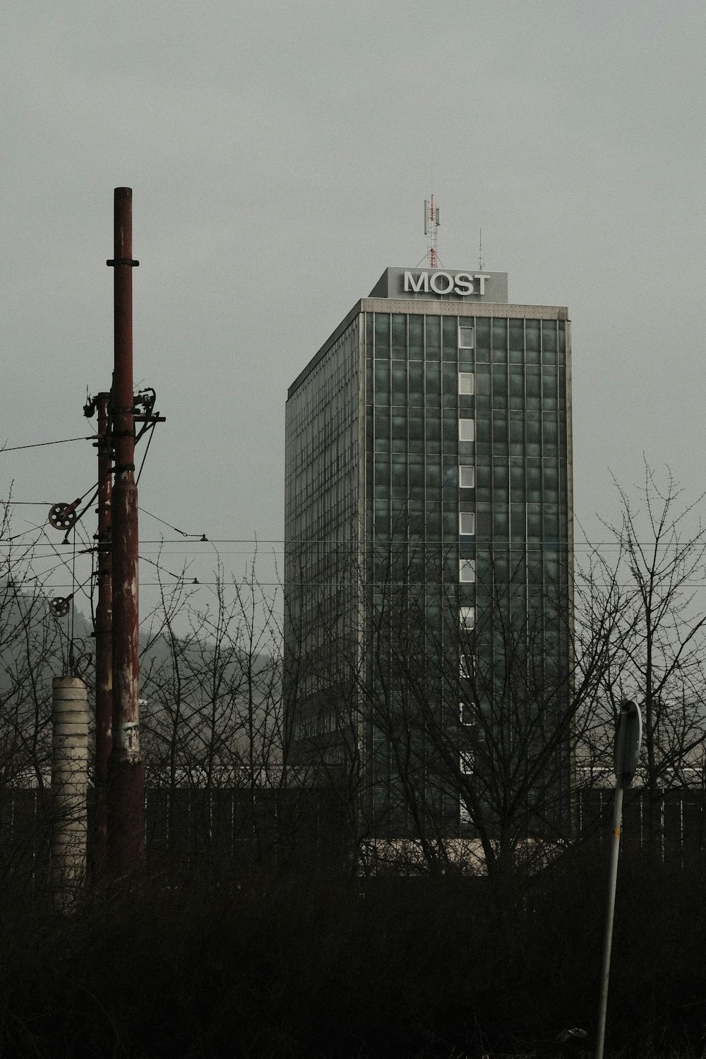 a tall building with a most sign on top of it
