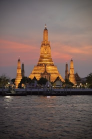 a large building sitting on top of a river