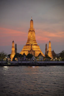 a large building sitting on top of a river