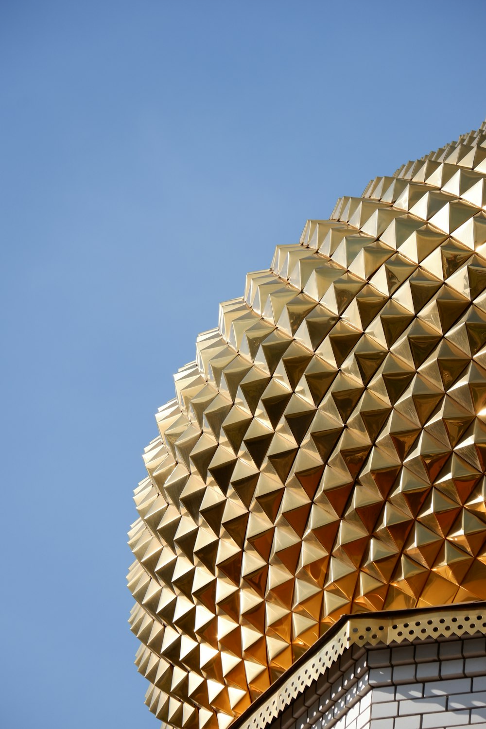 a close up of a building with a blue sky in the background