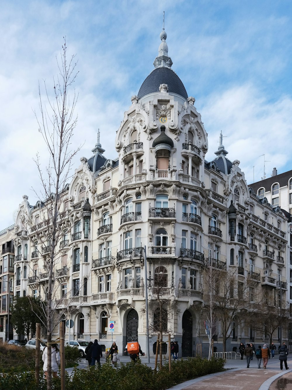 a large white building with many windows and balconies