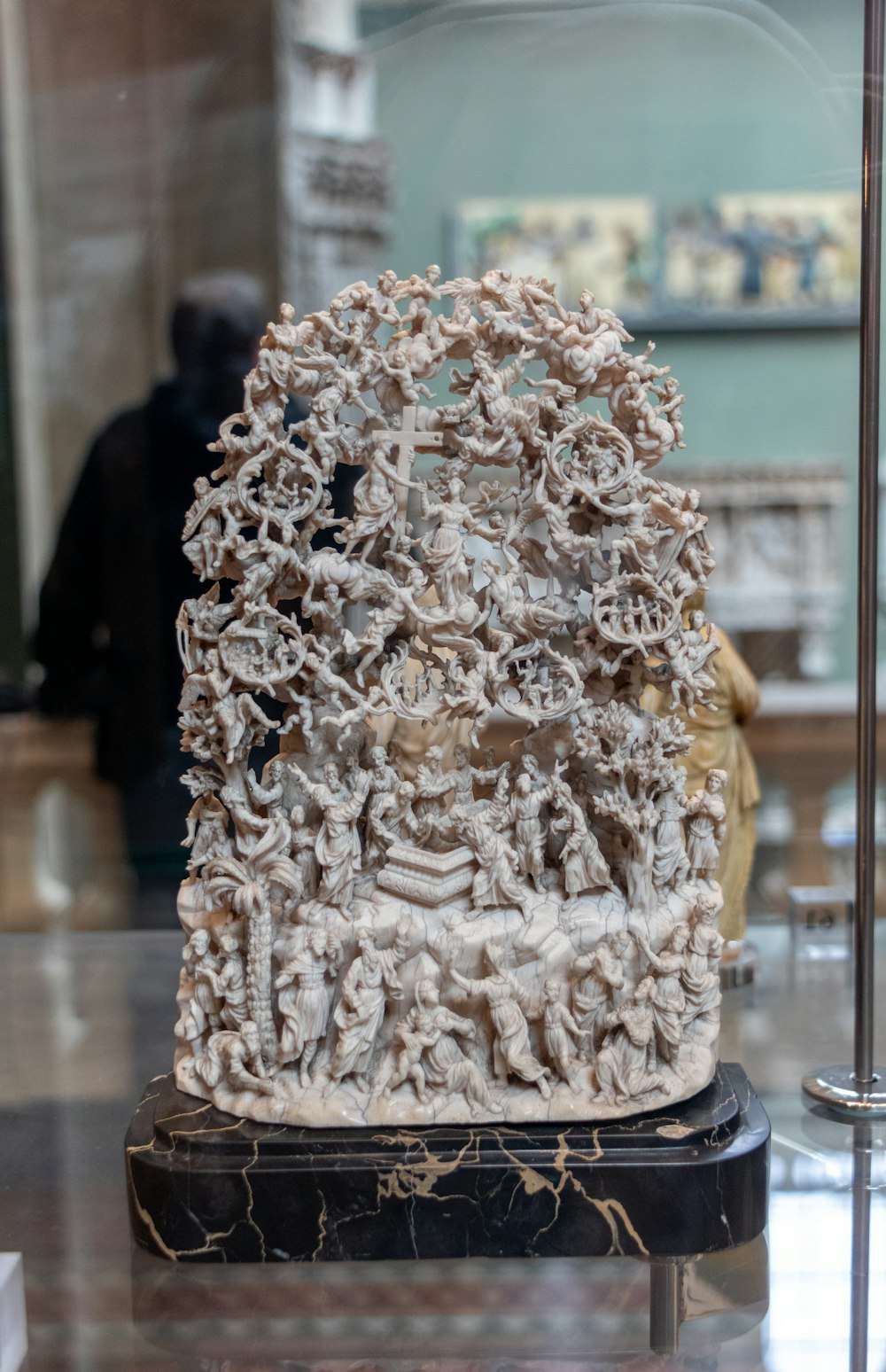 a sculpture of a group of people in a room