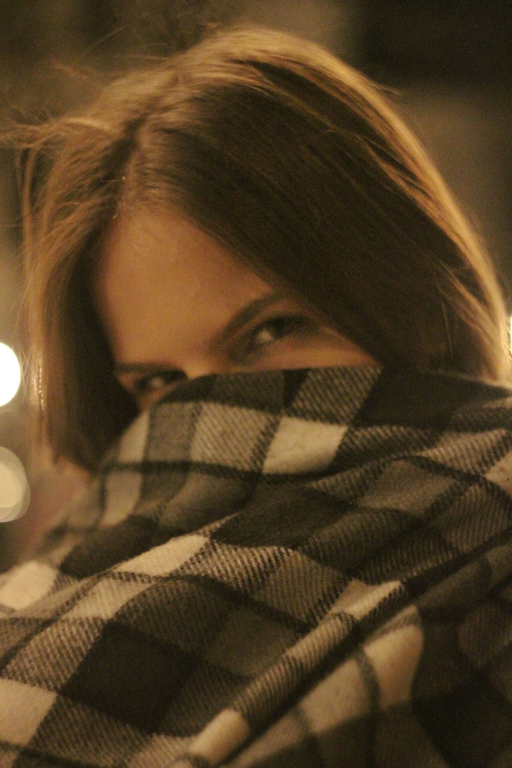 a close up of a person wrapped in a blanket