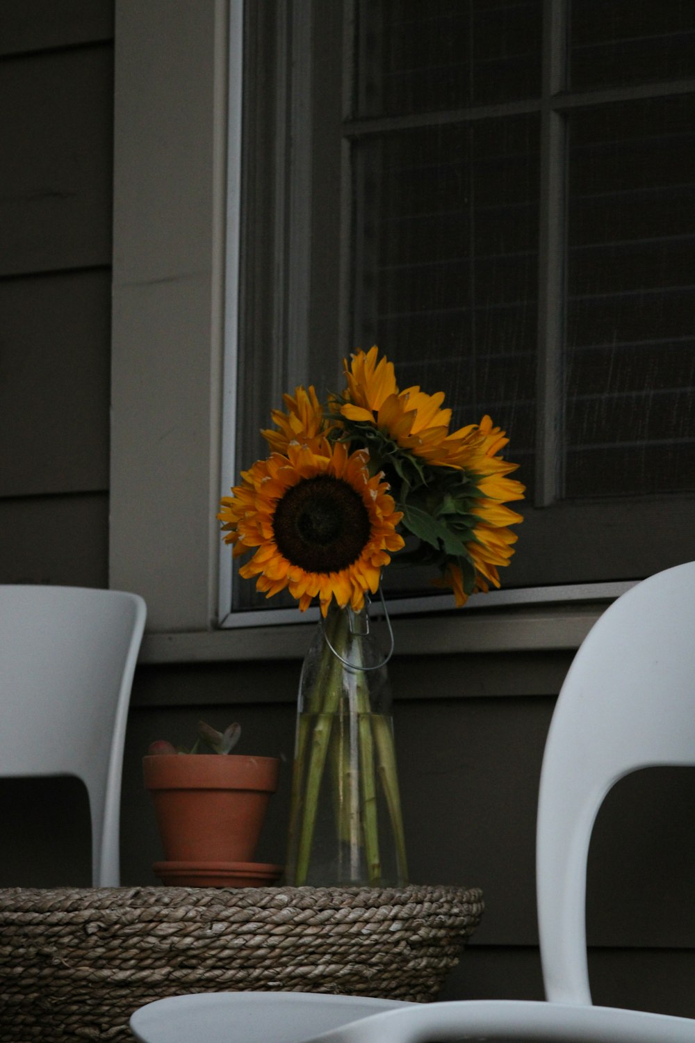 a vase of sunflowers sitting on a table