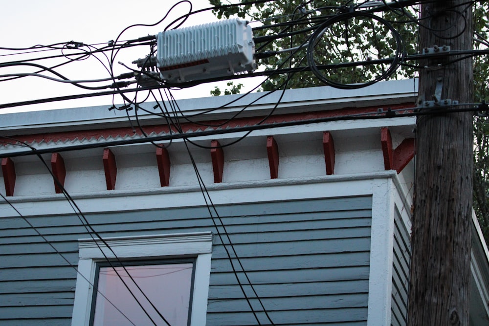 a house with a lot of wires on the roof