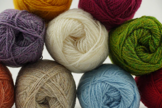 a group of balls of yarn sitting next to each other