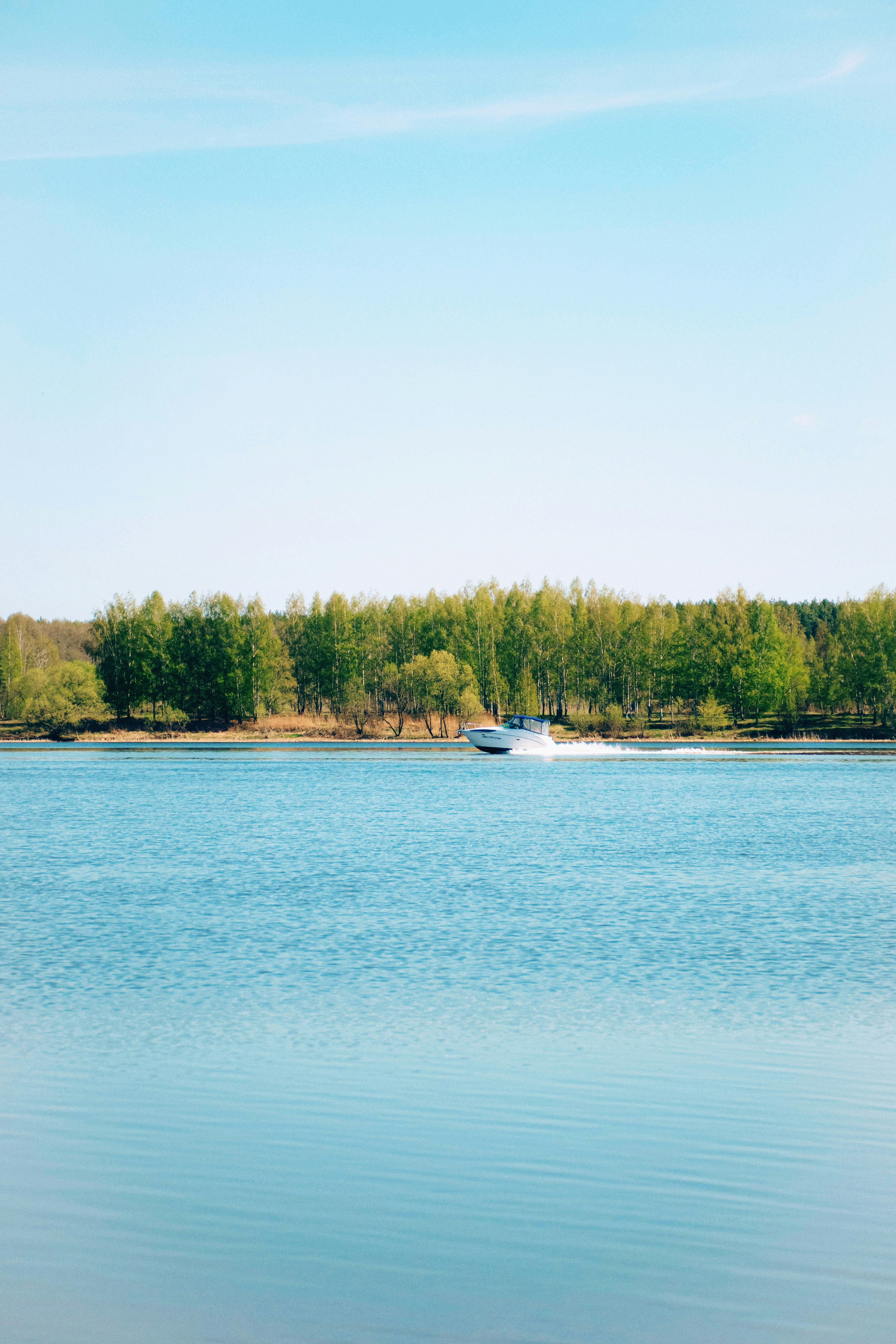 a boat is out on a calm lake