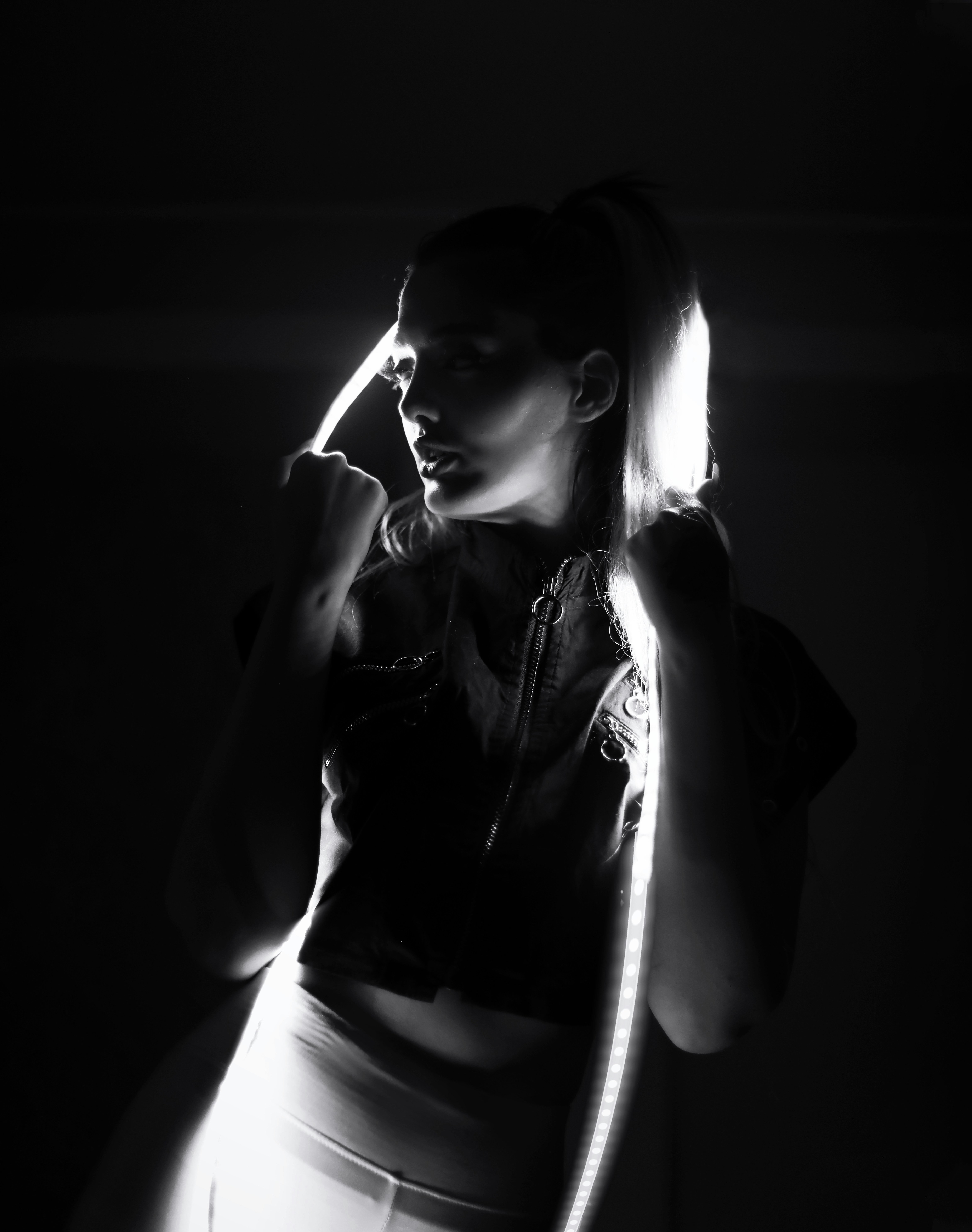 a woman in tight pants is talking on a cell phone