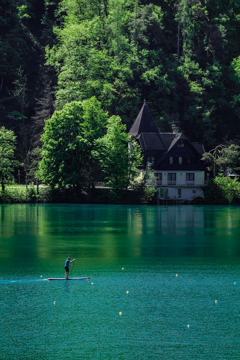 a person riding a surfboard on a body of water