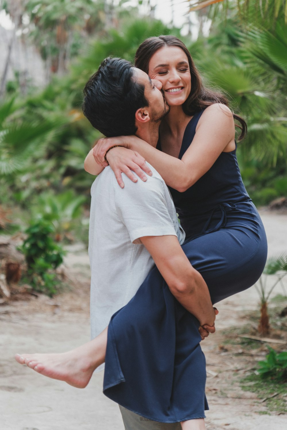 a man holding a woman in his arms