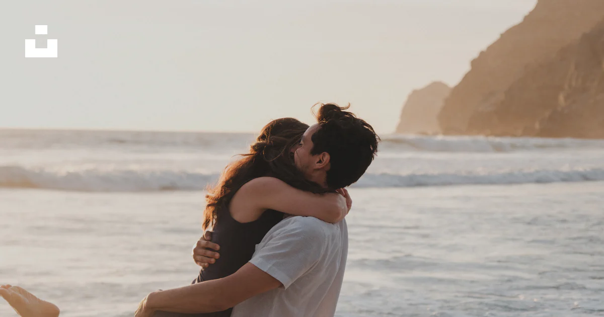 Seeman Hugging A man and a woman are hugging in the ocean photo – Free Grey Image on ...