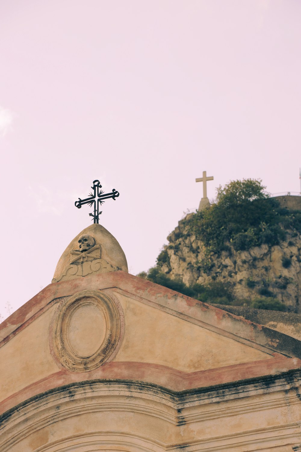 a church steeple with a cross on top