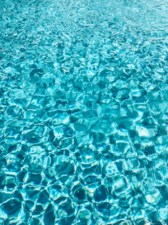 a blue pool with clear blue water