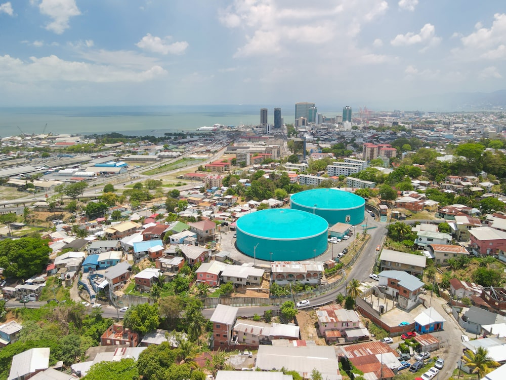 an aerial view of a city with a large pool