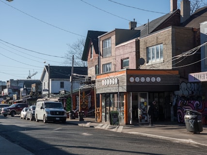 a city street with cars parked on the side of it