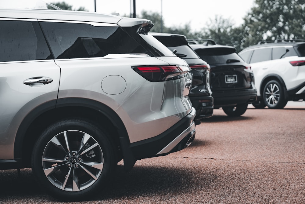 a line of cars parked in a parking lot