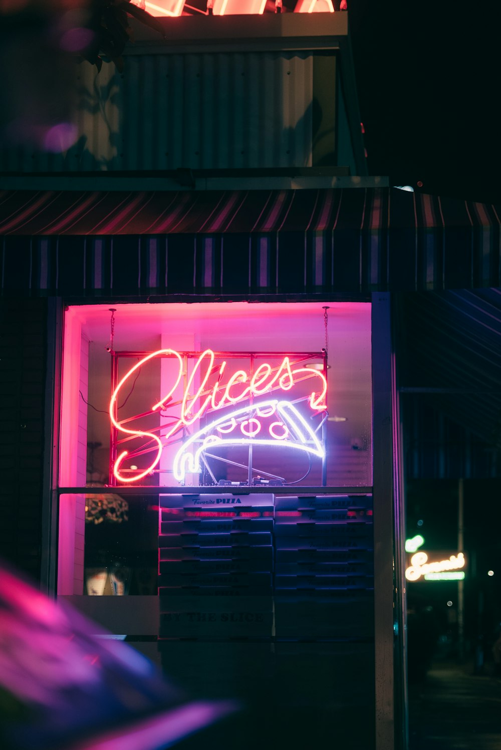 a neon sign on the side of a building