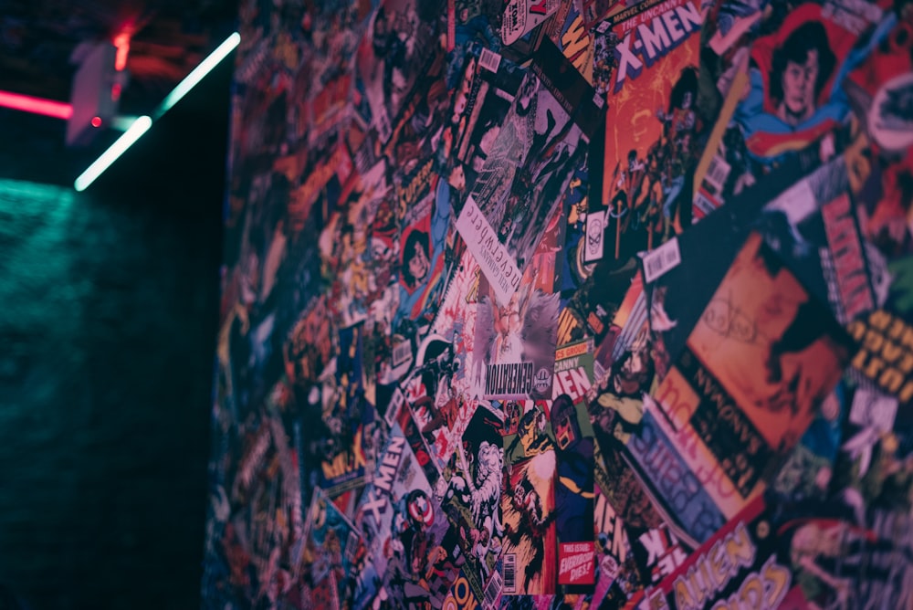 a wall covered in stickers and posters