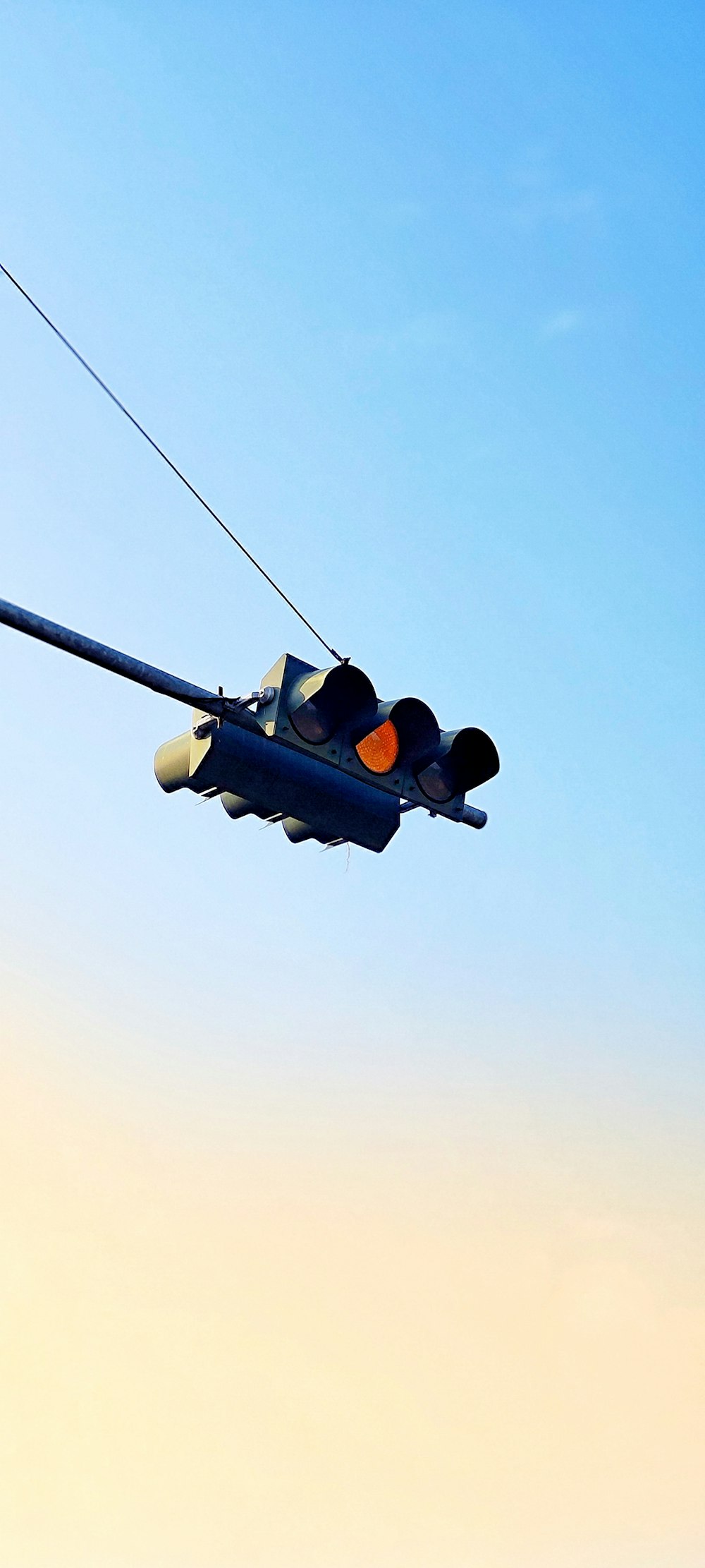 a fighter jet flying through a blue sky