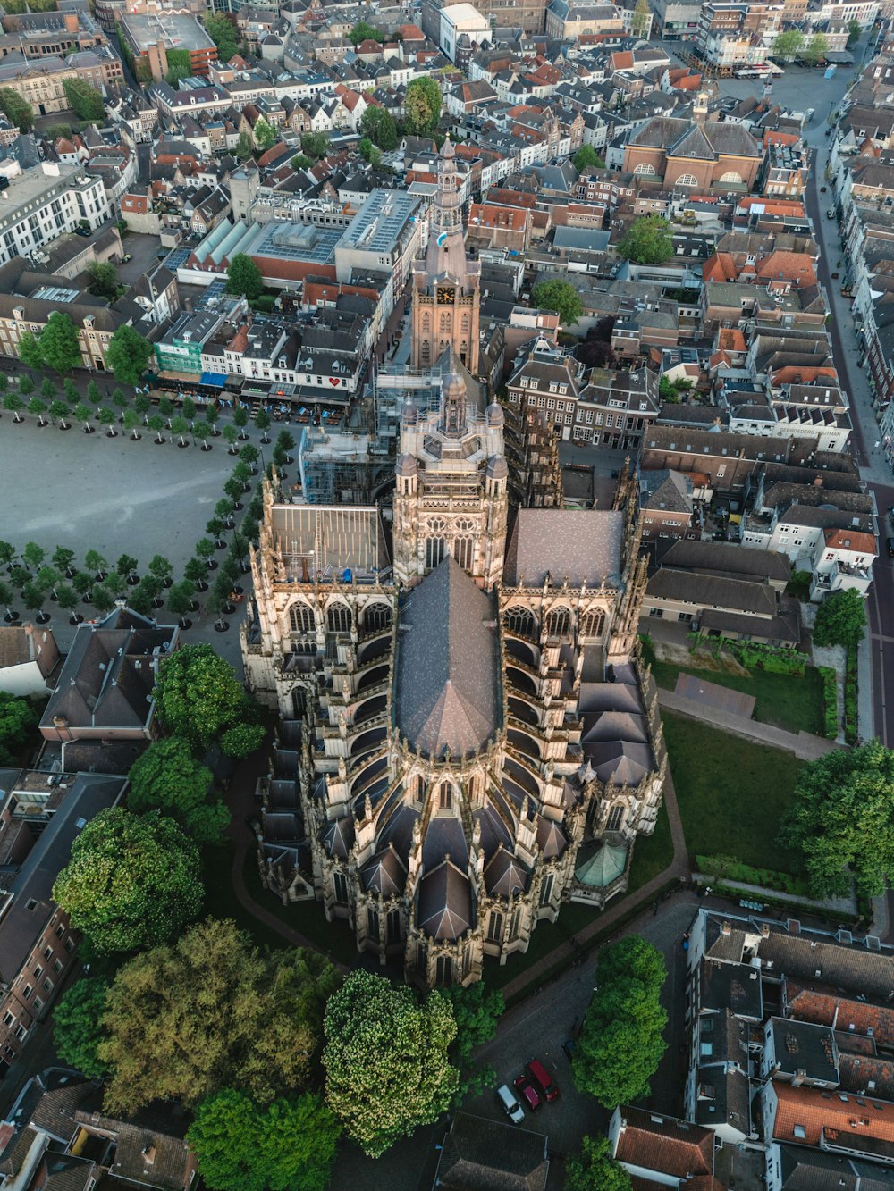 an aerial view of a cathedral in a city