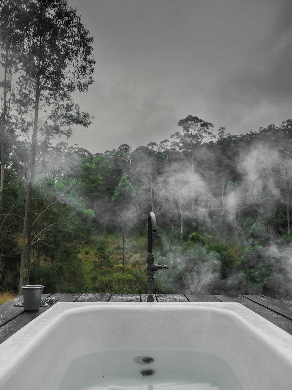 a hot tub sitting on top of a wooden deck