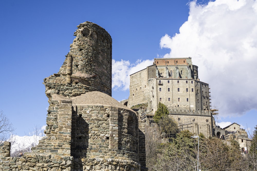 an old castle with a tower on top of it