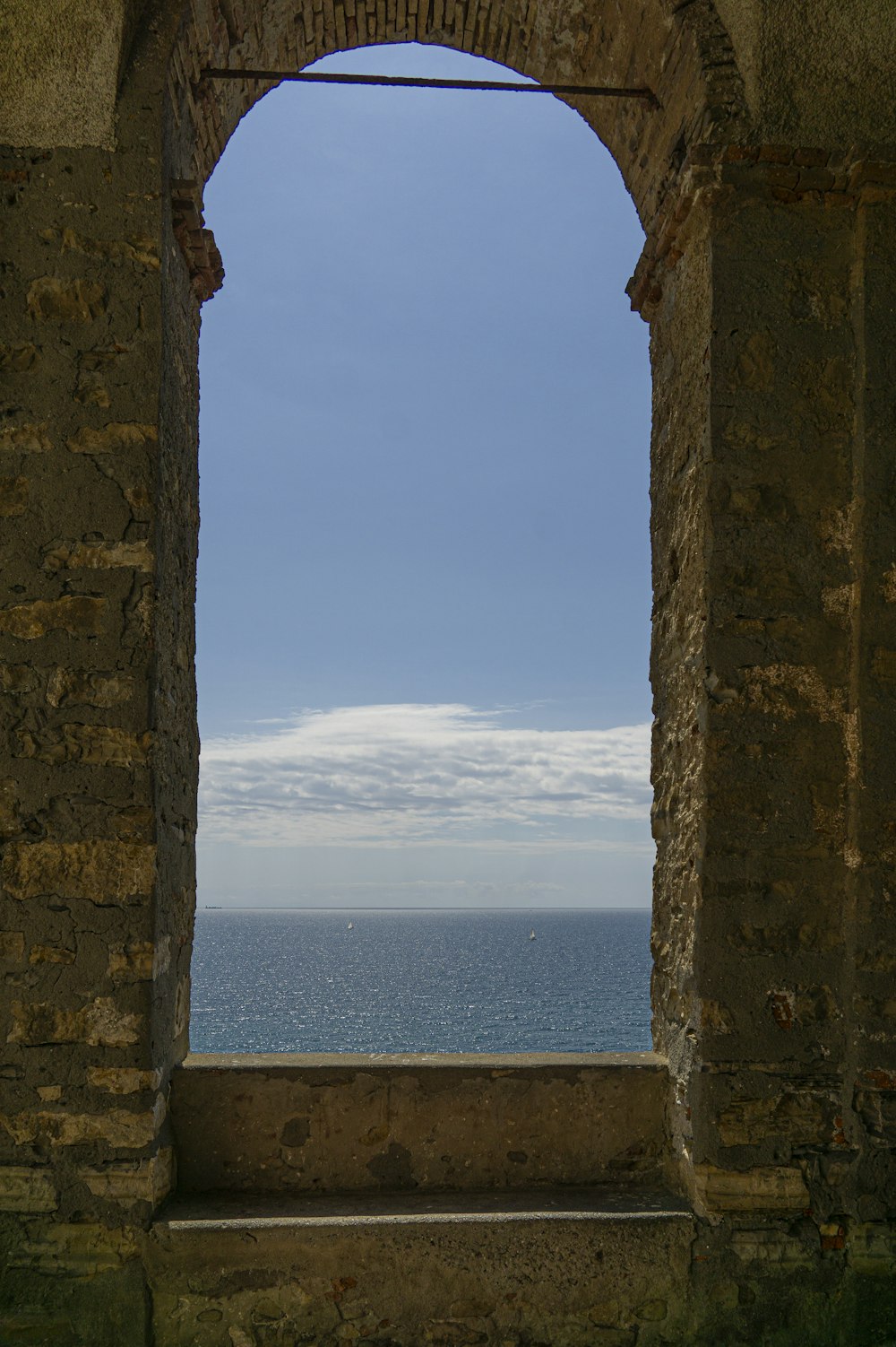 a window with a view of the ocean