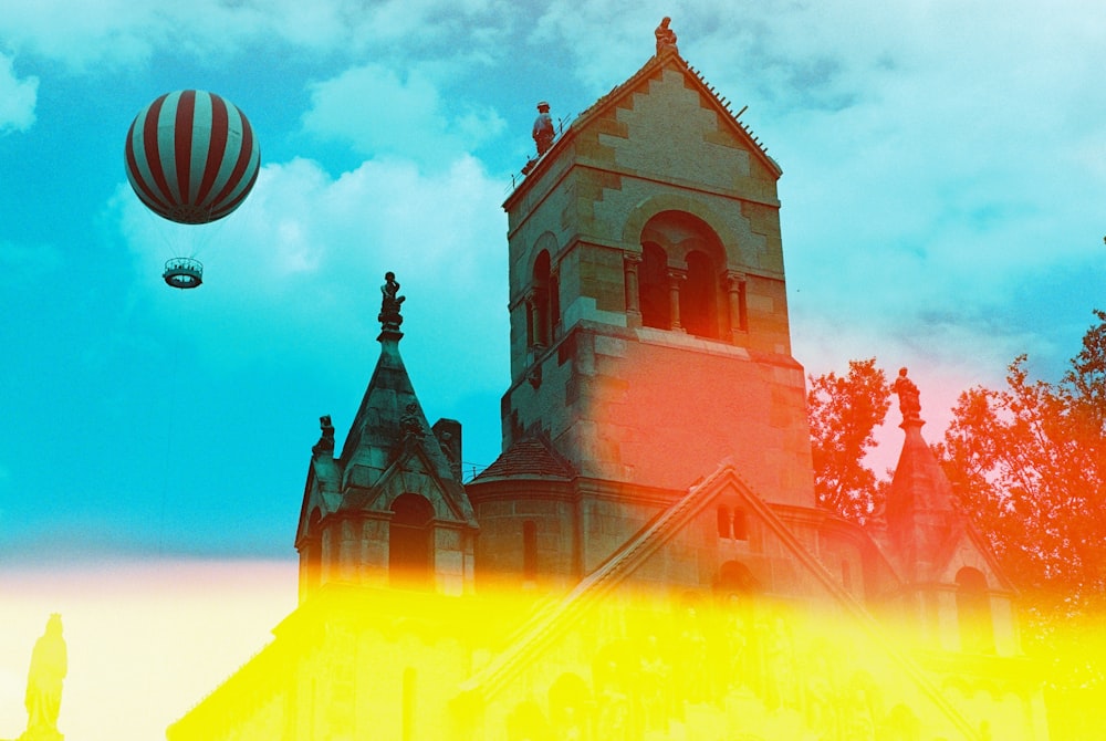 a church with a hot air balloon in the sky