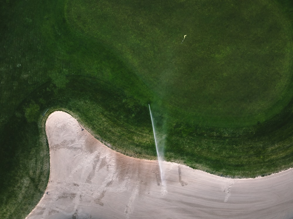 an aerial view of a green golf course