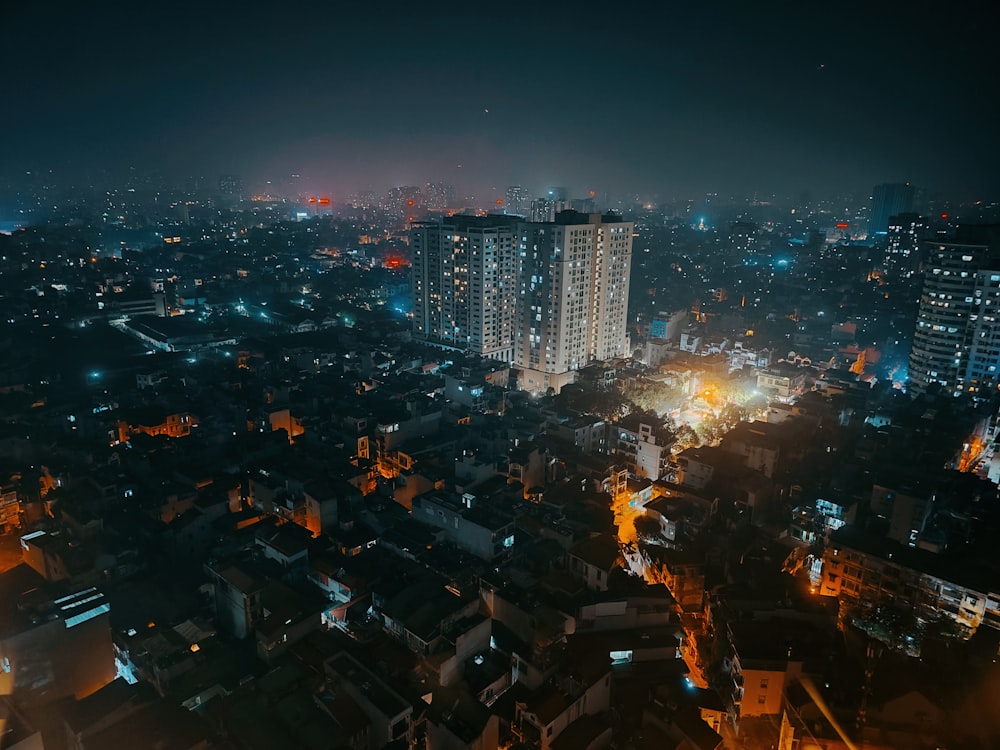 a view of a city at night from the top of a building