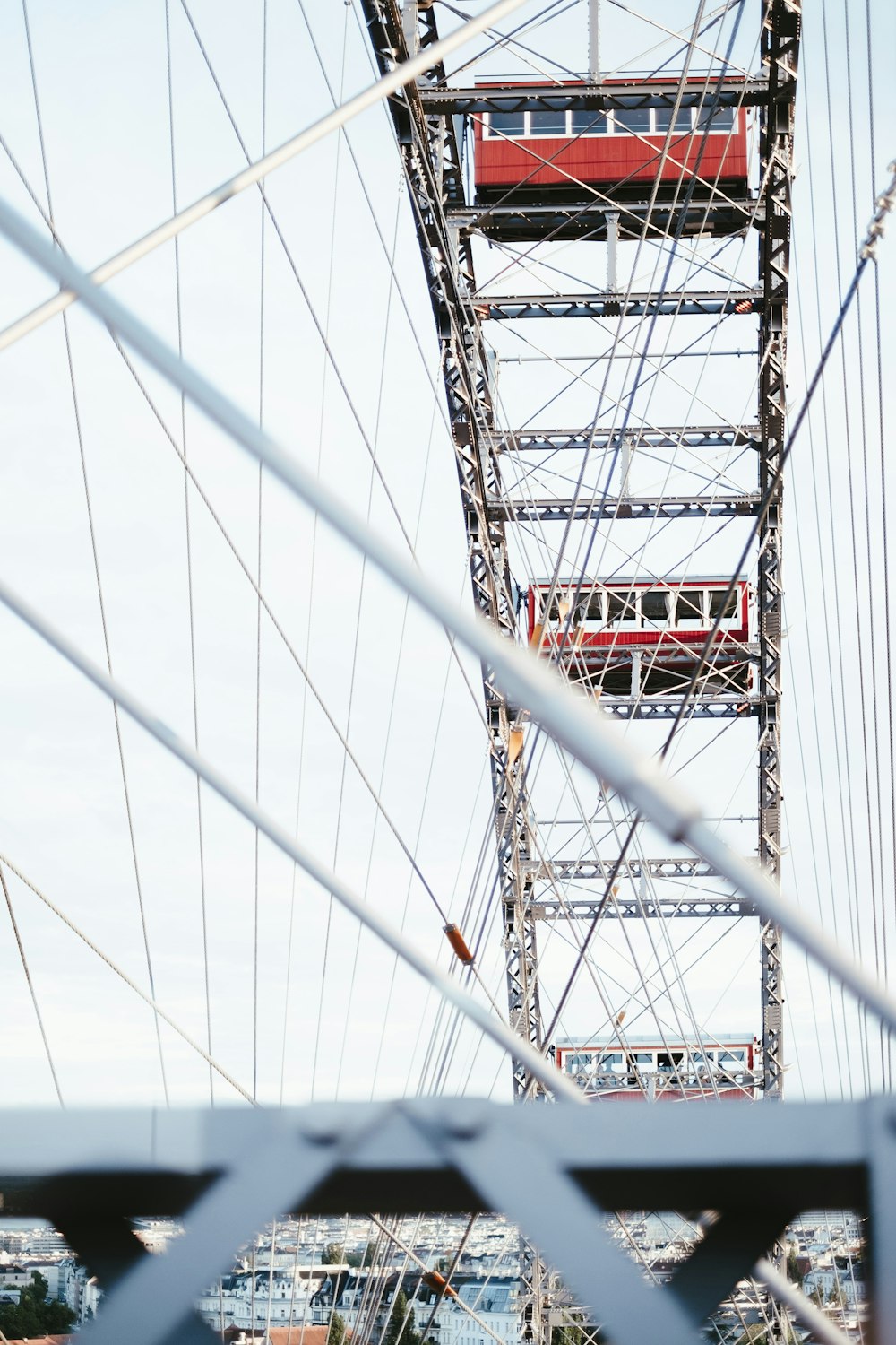 a red and white train traveling over a bridge