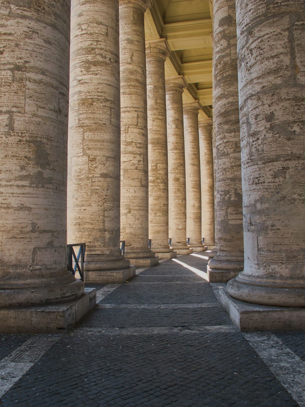 a row of large stone pillars sitting next to each other