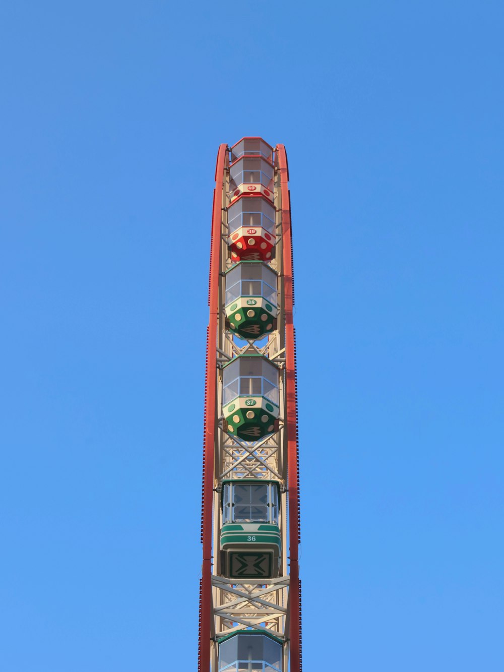 a ferris wheel on a clear day with a blue sky