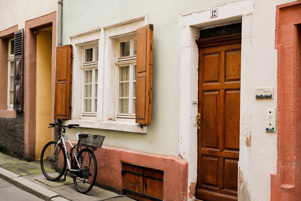 a bicycle is parked in front of a building