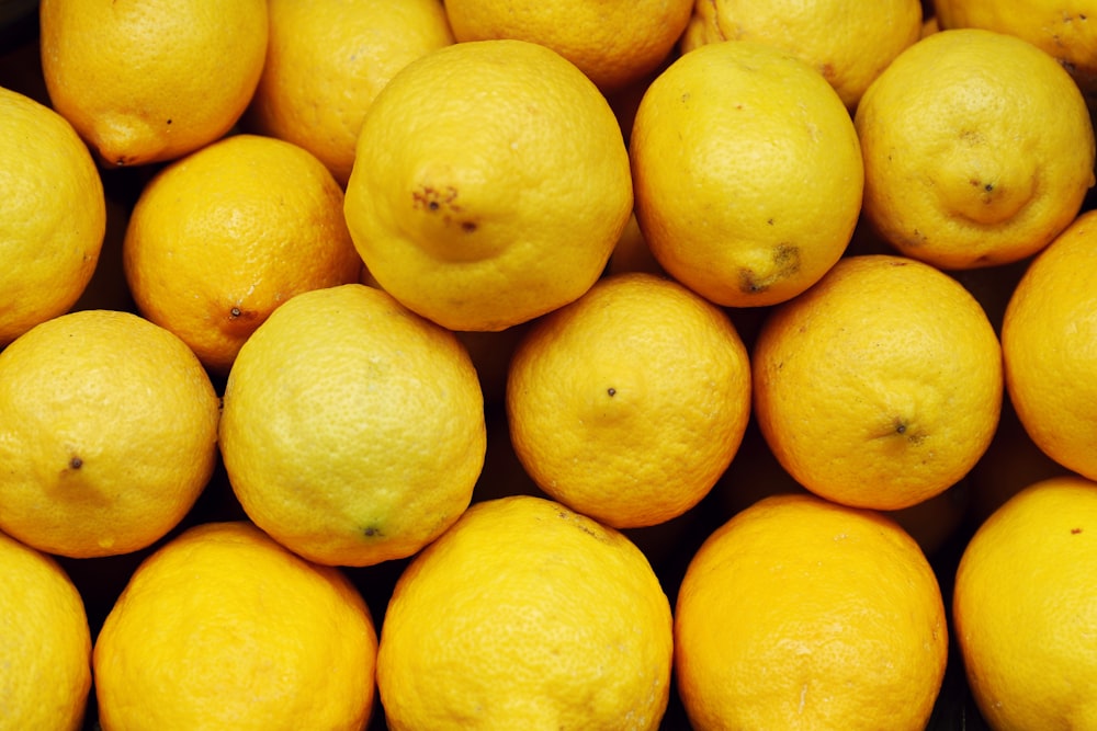 a pile of lemons sitting next to each other