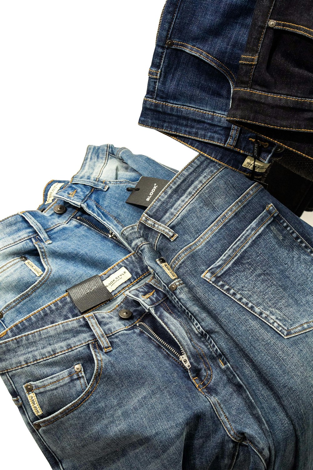 a pair of jeans with a cell phone in the back pocket