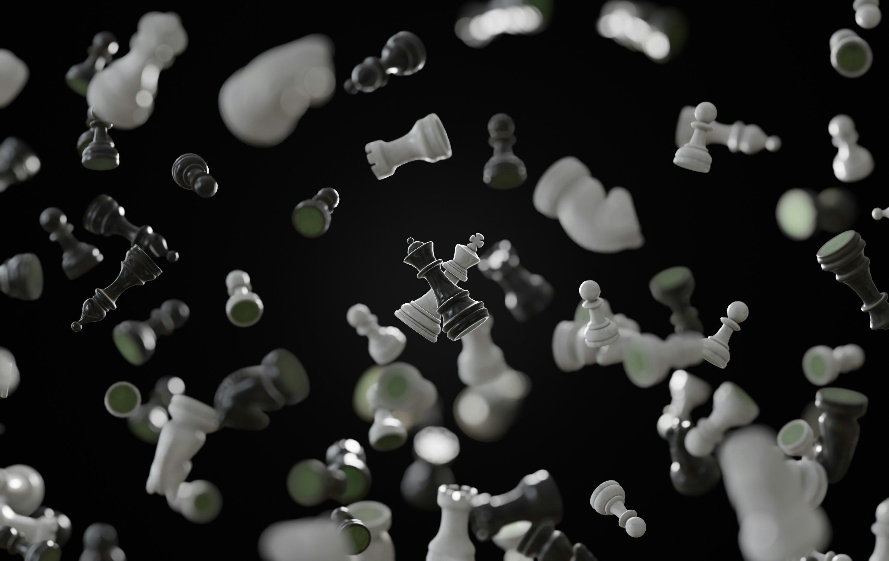 a black and white photo of chess pieces