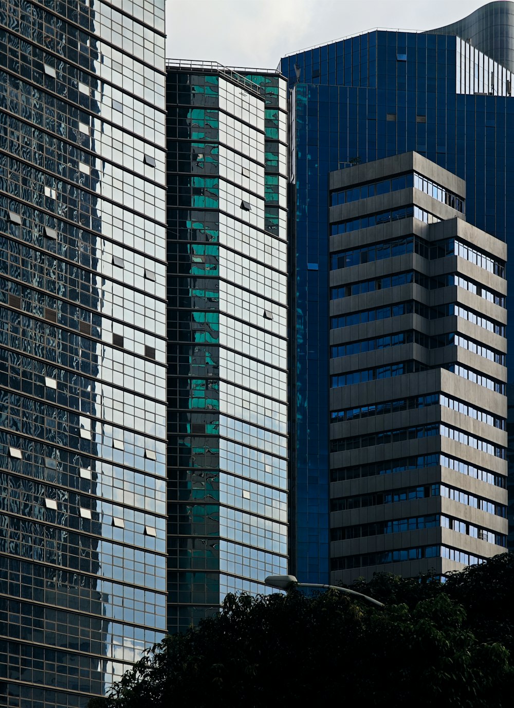 a plane flying over a city with tall buildings