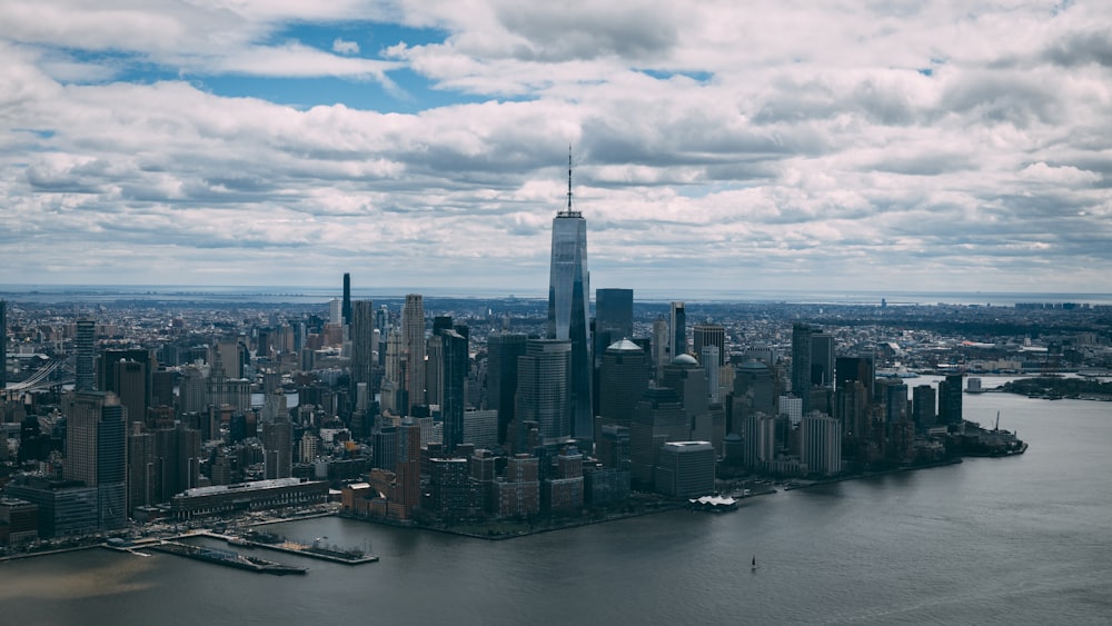 an aerial view of a large city and a body of water