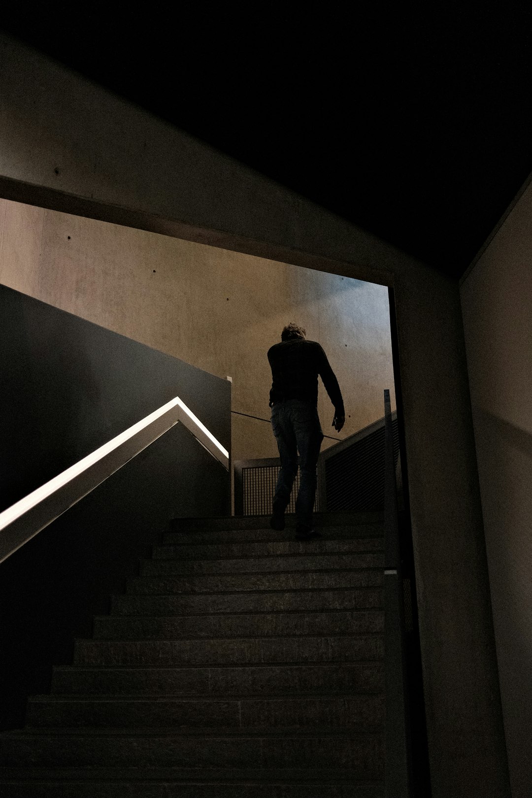 a man walking up a flight of stairs