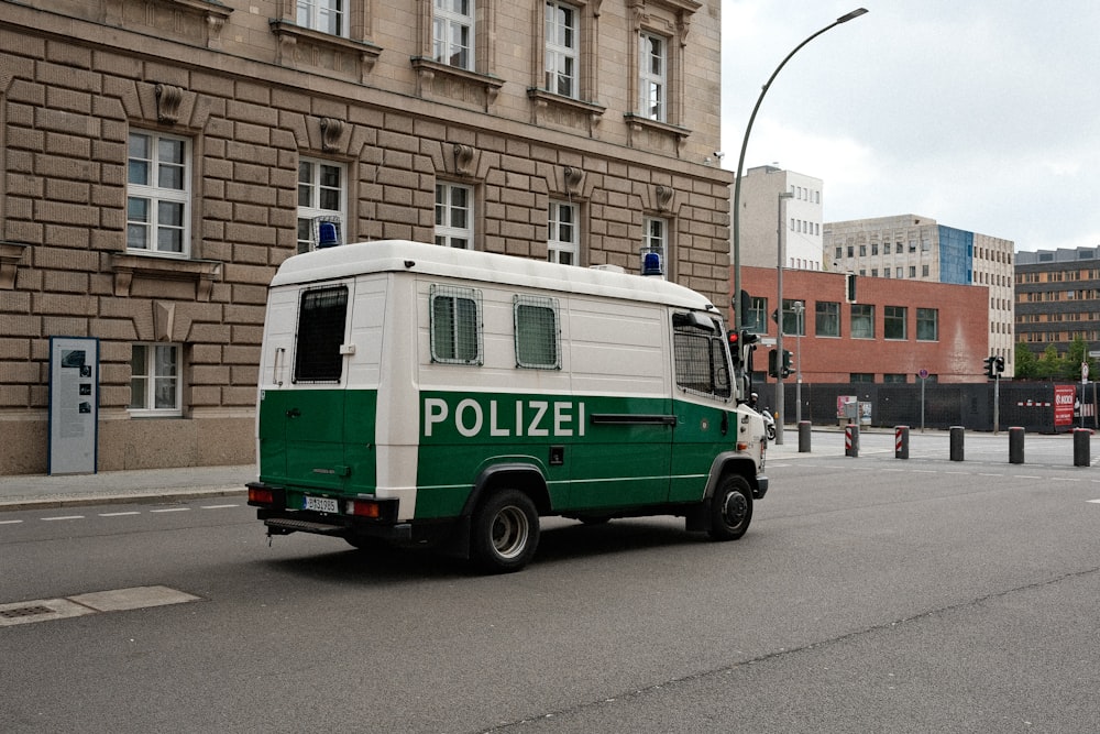 a police van driving down a city street