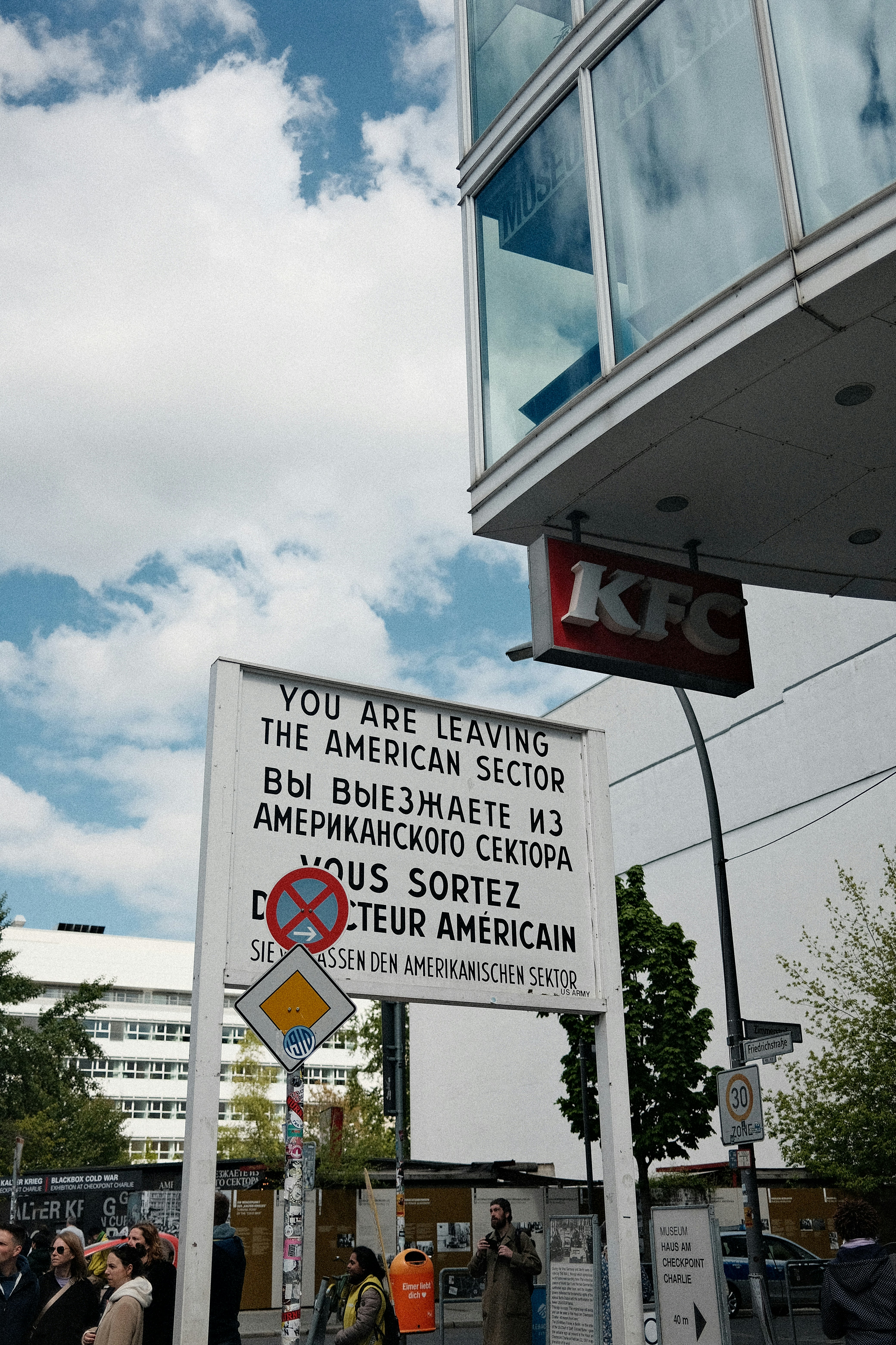 a group of people standing outside of a building