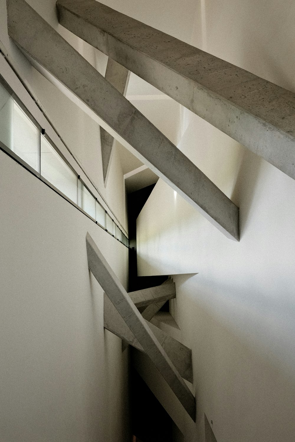 a very long and narrow staircase in a building
