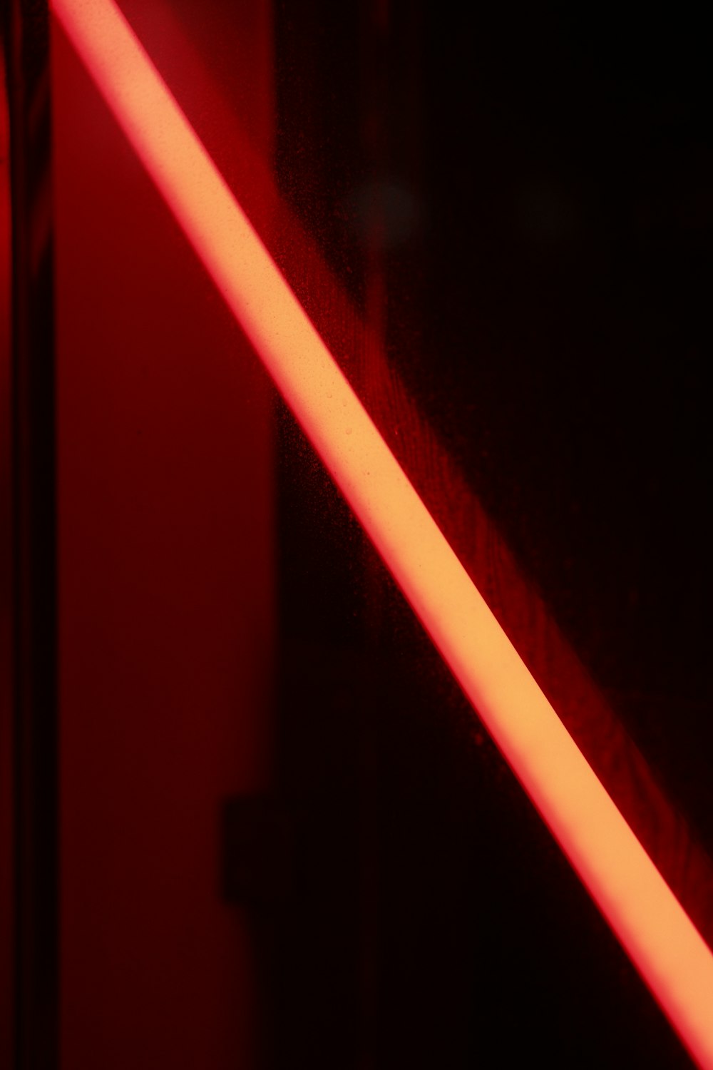 a close up of a light saber in a dark room