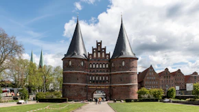 a castle like building with a walkway leading to it