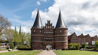 a castle like building with a walkway leading to it