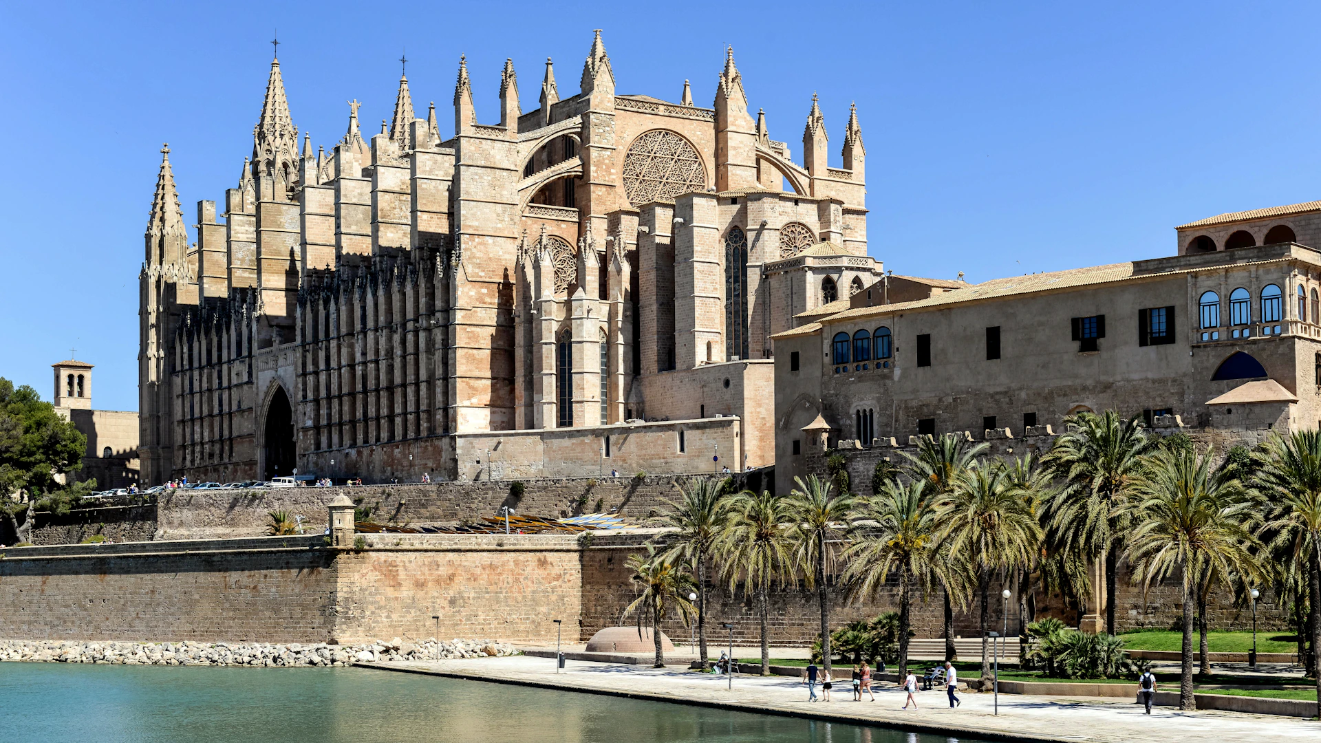 a large building sitting next to a body of water